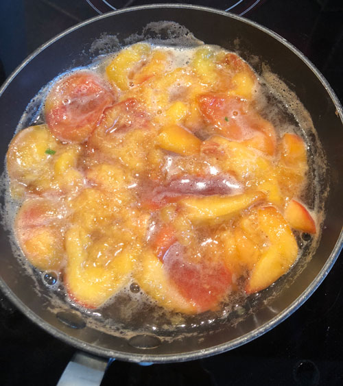 peaches in pan simmering