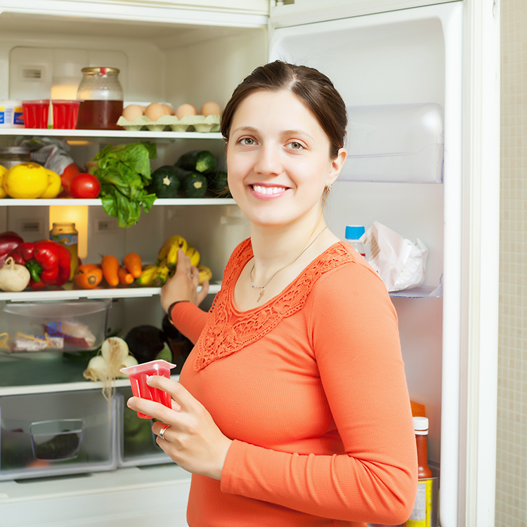 Woman opeing fridge